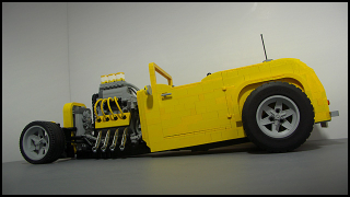 Illustration for article titled More LEGO madness... AFOL designs/builds coolest hot-rod yet...